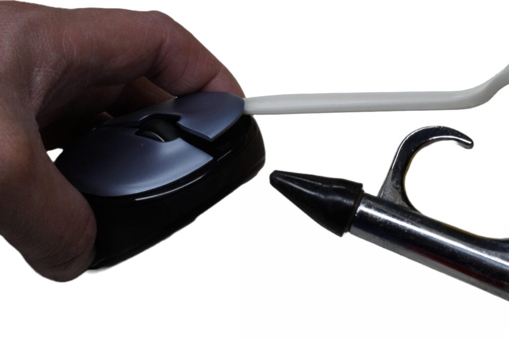 using compressed air to clean the switches on a Logitech mouse